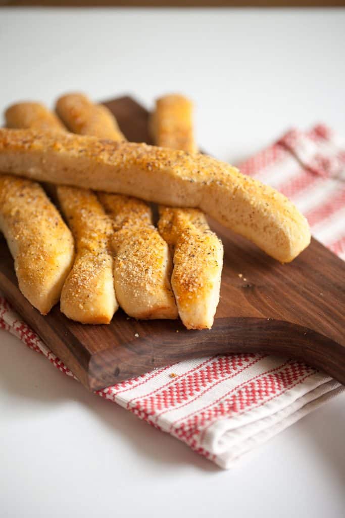 These 1-hour wheat breadsticks are buttery and delicious. Homemade easy breadsticks are totally possible with this recipe. 