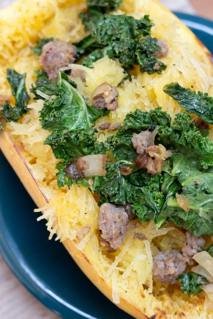 This spaghetti squash with sausage and kale from Call Me Betty is a unique way to use up the spaghetti squash that's taking over your garden! callmebetty.com