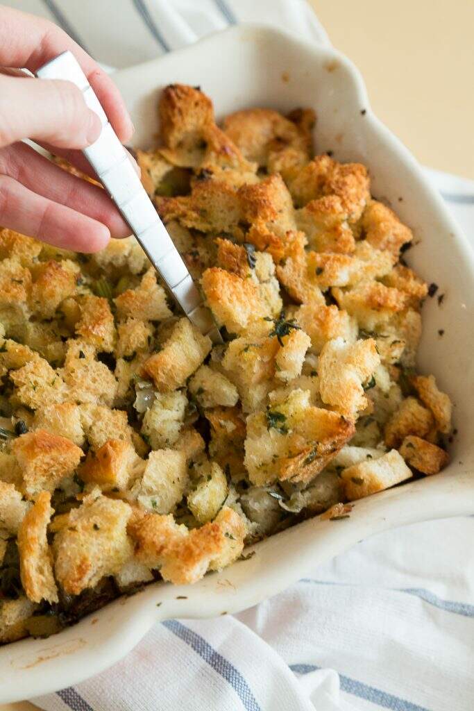 Make-ahead herb stuffing with serving spoon 