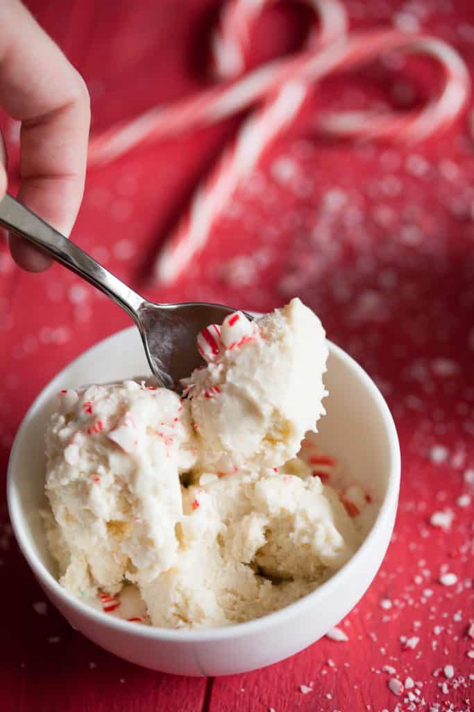 This homemade peppermint candy cane ice cream is the most wonderful holiday treat, it's especially delicious when enjoyed with brownies!