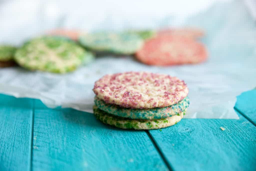 Soft and chewy sugar cookies are the perfect crinkly texture. Homemade soft-batch cookies coated in sprinkles are easy with a few tips.