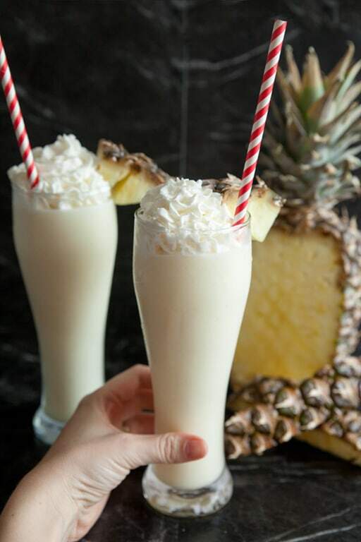 hand holding non-alcoholic piña colada