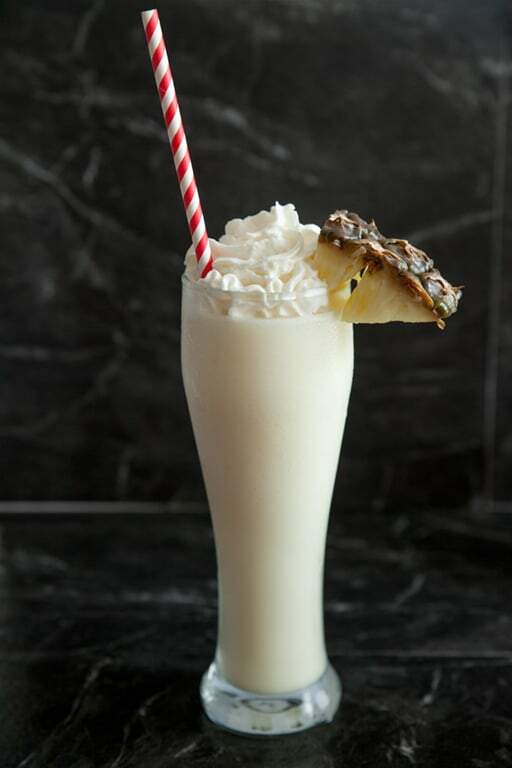 non-alcoholic piña colada with pineapple wedge 