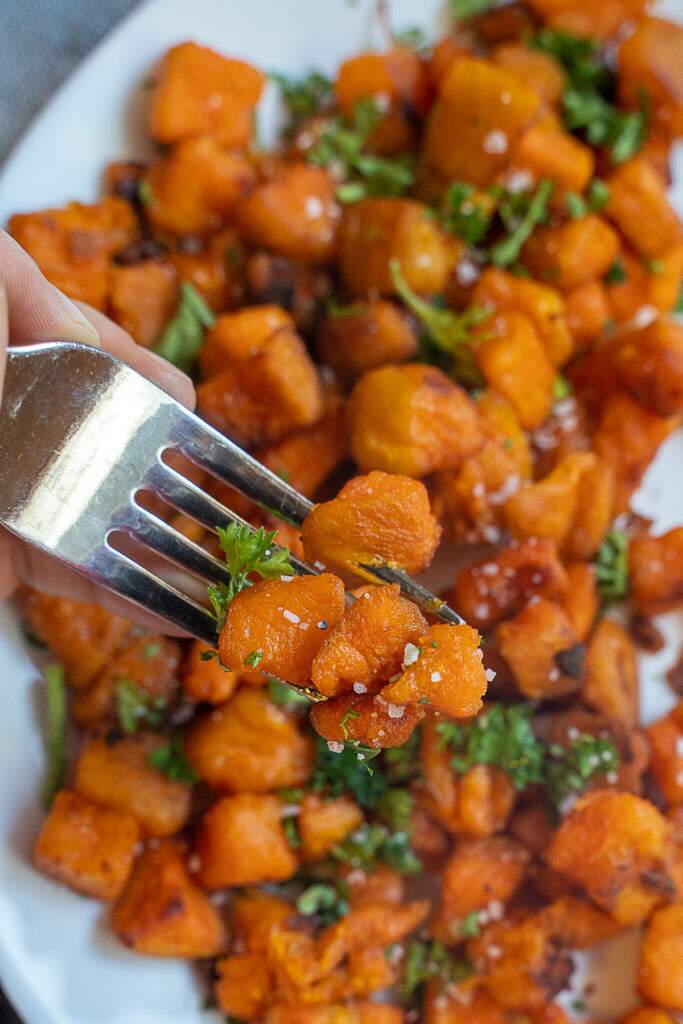Close up of sweet potato home fries with parsley